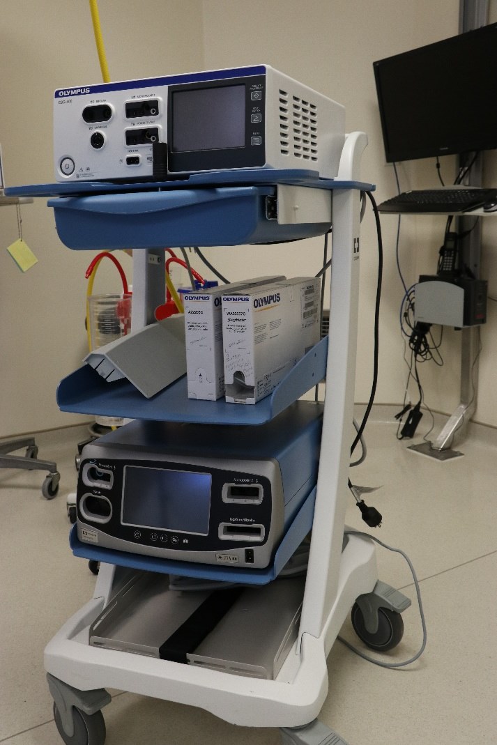 A picture containing text, indoor, floor, desk

Description automatically generated